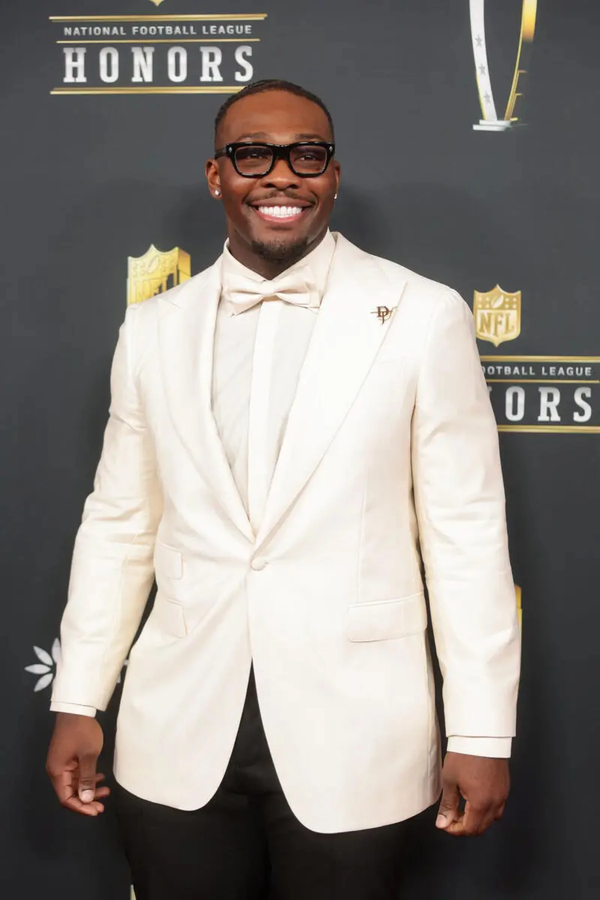 Larry Ogunjobi Stuns in White Blazer