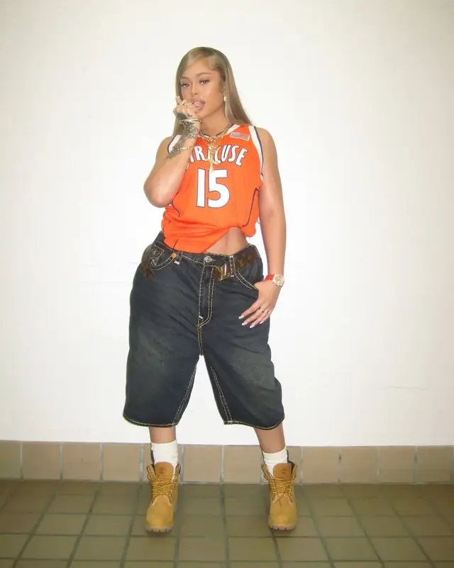 American Rapper Latto in Syracuse Orange Football Jersey – April 2025 Look